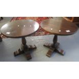 Pair of mid century circular oak lamp tables on shaped, quadraform base. (2) (B.P. 21% + VAT)
