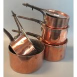 Collection of 19th century mainly copper lidded pans with iron handles, some marked 'Harrods'. (