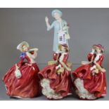 Four Royal Doulton bone china figurines to include 'Autumn Breezes', two 'Top o' the Hill'