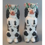 Pair of 19th century Staffordshire black and white begging spaniel dog single-handled jugs with