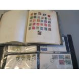 Collection of all world stamps in blue album, together with two albums of Great Britain first days