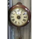 Late 19th century stained beech postmans alarm wall clock with painted Roman face. 22cm diameter