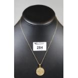 A gemset medallion, 'Acapulco' on 14ct gold chain. (B.P. 21% + VAT)