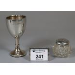 Silver egg cup dated 1929, together with a small silver topped and glass dressing table jar. (B.P.