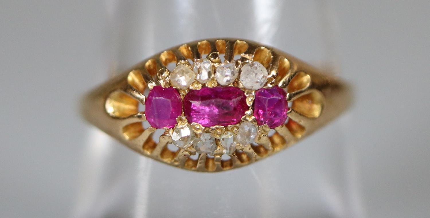 Yellow metal ruby and diamond ring. Ring size O&1/2. Approx weight 2 grams. (B.P. 21% + VAT)