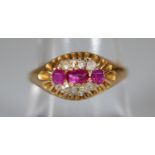 Yellow metal ruby and diamond ring. Ring size O&1/2. Approx weight 2 grams. (B.P. 21% + VAT)