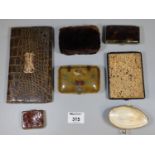 Collection of vintage purses including a shell purse, a 1920's beaver skin purse, two cigarette