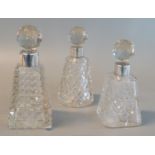 Three late Victorian silver topped scent bottle with faceted stoppers and conical body. Chester