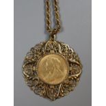 A Victorian 1900 gold sovereign in ornate 9ct gold mount on 9ct chain. Approx weight 25.5 grams. (