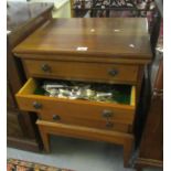 Mahogany finish four drawer cutlery chest on stand, the interior revealing various silver plated and