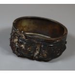 A large Victorian buckle bangle engraved with foliage. Approx weight 40 grams. (B.P. 21% + VAT)