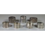 Collection of seven silver napkins rings, some with ornate decoration. 5.1oz troy approx. (B. P. 21%