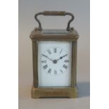 Brass French carriage clock with white enamel face and Roman numerals. (B.P. 21% + VAT)