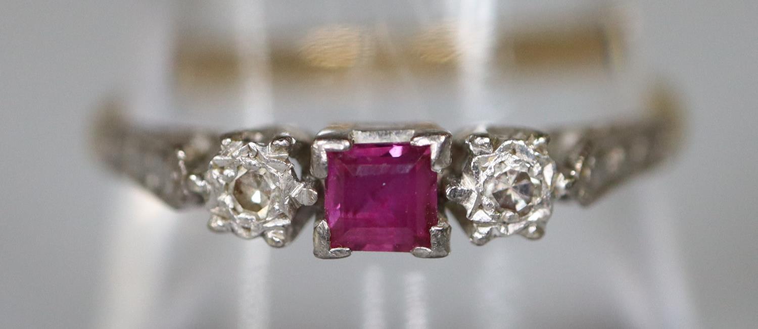 An 18ct gold platinum mounted ruby and diamond ring. Ring size P. Approx weight 2.5 grams. (B.P. 21%