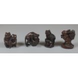 Collection of four Japanese carved netsukes to include monkey, ram, rabbit, etc. Signed character