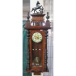 Early 20th century two-train Vienna type wall clock with Roman face and horse pediment. 145cm high