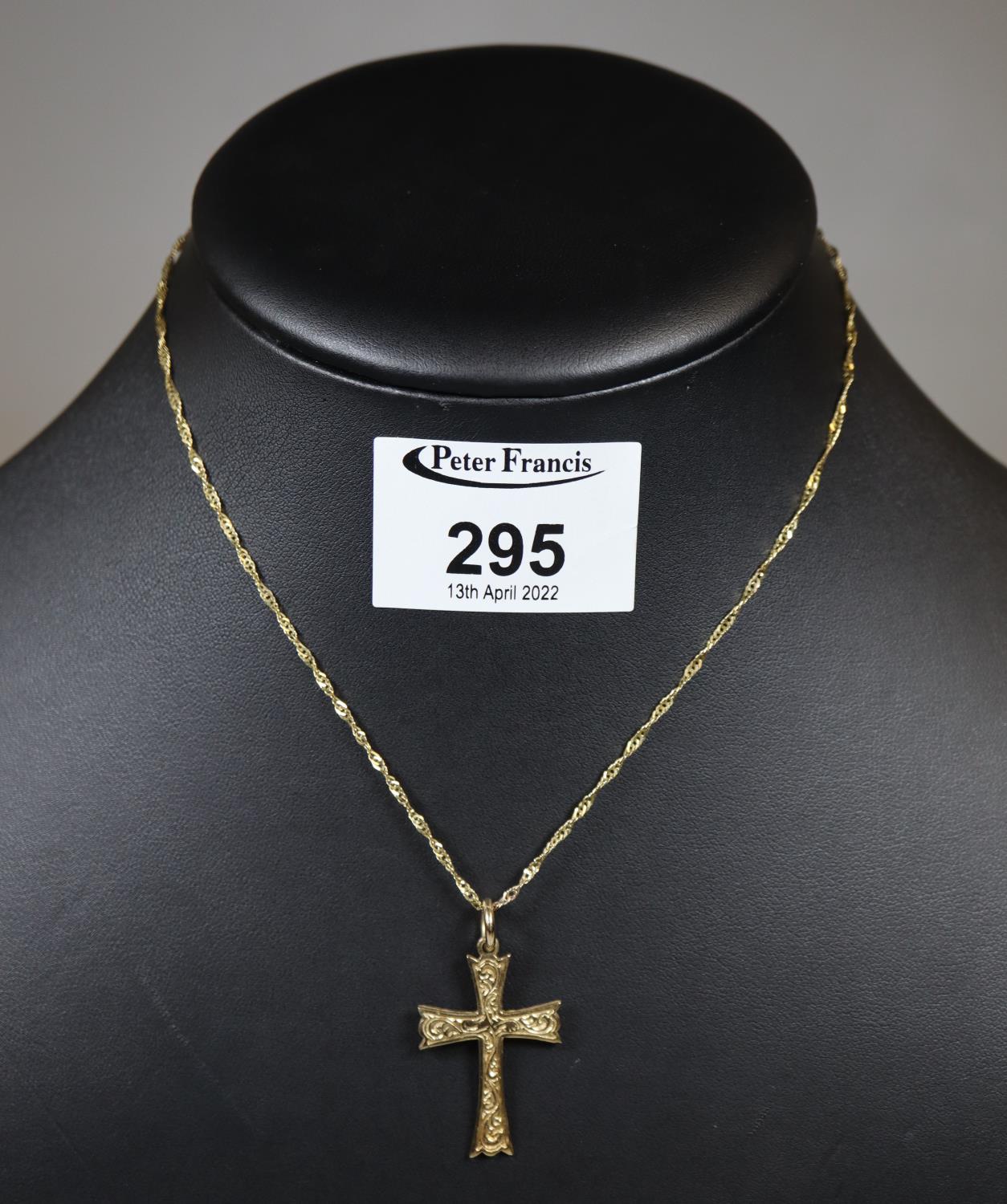 9ct gold cross pendant on a 9ct gold chain. Approx weight 4.2 grams. (B.P. 21% + VAT)