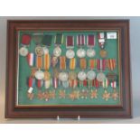 A Framed Collection of Assorted British WWI and WWII Medals to include various Stars, War Medals,