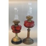 Two similar early 20th century double oil burner lamps, both with cranberry reservoirs. (2) (B.P.