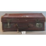 Leather suitcase containing assorted items including army medical corps shield, plaque,