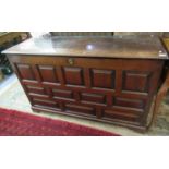 18th century Welsh oak coffer having twelve square and rectangular fielded and moulded panels,