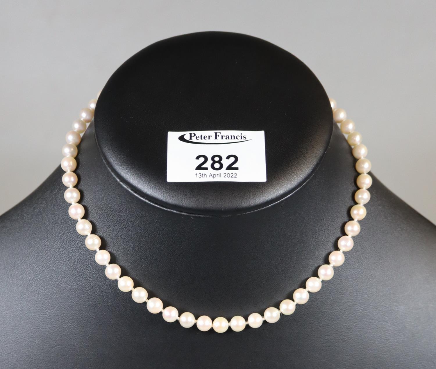 String of cultured pearls with 9ct gold pearl set clasp. (B.P. 21% + VAT)