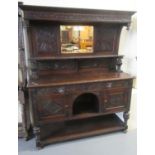 Late Victorian carved oak 2 stage mirror back sideboard with mask head mounts and handles standing