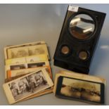 French Souvenir de Paris ebonised table-top stereoscopic viewer, together with a collection of