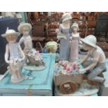 4 Boxed Lladro Figurines and Figure Groups: Girl with Wheelbarrow and Flowers, Boy on a Bike with