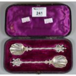 Pair of Victorian silver shell-shaped spoons with coat of arms terminal in fitted case. London