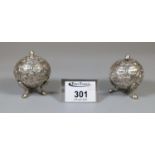 A pair of decorative white metal pepperettes. Approx weight 3 oz. (B.P. 21% + VAT)