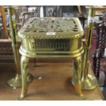 19th Century brass pierced footman together with a pair of brass candlesticks. (B.P. 21% + VAT)