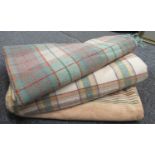 Two Welsh multicoloured checked blankets and another similar striped blanket. (3) (B.P. 21% + VAT)