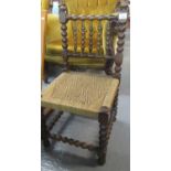 Early 20th Century mahogany child's chair with bobbin turned supports and rush seat. (B.P. 21% +