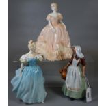 Two Royal Doulton bone china figurines to include 'The Milkmaid', and 'Enchantment', together with a