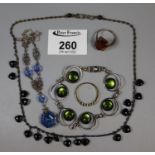 Collection of costume jewellery including an orange stone ring, green glass bracelet etc. (B.P.