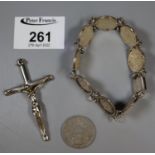 A bracelet of three pence, a large 925 silver crucifix and. 5pta coin. (B.P. 21% + VAT)