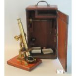 Brass monocular microscope on mahogany base with fitted mahogany box. (B.P. 21% + VAT)