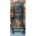 17th Century style stained oak high back chair with carved foliate decoration on a moulded seat with