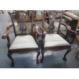 Pair of mahogany Chippendale style open arm chairs - having removable stuff over seat, standing on