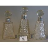 Three late Victorian silver topped scent bottle with faceted stoppers and conical body. Chester