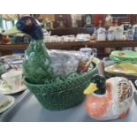 Ceramic egg crock in the form of a duck, together with another ceramic model of a duck. (2) (B.P.