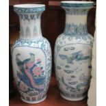 Two similar Chinese design baluster shaped floor vases decorated with reserved panels of birds (