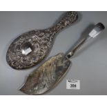 A Victorian Irish silver fish slice engraved with fish and scrolling waves, maker WC Dublin 1869.