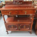 Edwardian mahogany buffet, having fitted drawers and doors, standing on ball and claw feet. 107 x 53