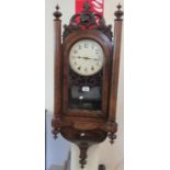 Late Victorian walnut two-train wall clock with painted Arabic face and fox mask moulded