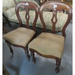 Pair of Victorian mahogany slat-back serpentine front dining chairs on baluster turned legs. (2) (