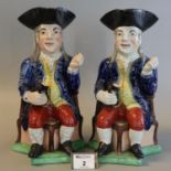 Pair of late 18th/early 19th century Staffordshire pottery toby jugs of seated topers with foaming