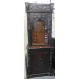 17th Century Flemish style oak two stage book case cabinet ornately carved with classical and