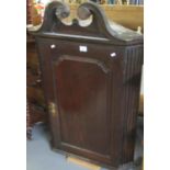 18th Century oak blind panelled hanging corner cupboard - the interior revealing 3 shaped
